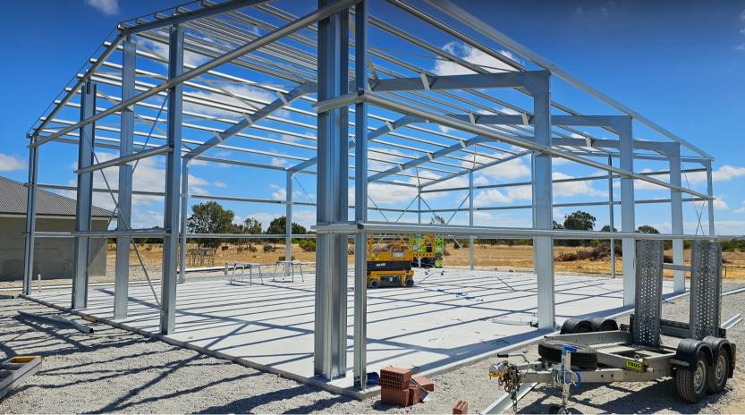 Steel shed frame under construction on a rural block